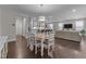 Spacious open-concept dining area connecting to a well-lit kitchen and living room at 4009 Reunion Creek Pkwy, Apex, NC 27539