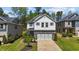 Charming two-story home featuring a two-car garage, stone accents, and a well-maintained front yard at 4009 Reunion Creek Pkwy, Apex, NC 27539