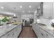 Bright, spacious kitchen featuring stainless steel appliances, granite countertops, and ample cabinet space at 4009 Reunion Creek Pkwy, Apex, NC 27539