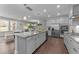 Spacious kitchen with a large center island, stainless steel appliances, and open layout to living area at 4009 Reunion Creek Pkwy, Apex, NC 27539