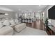 Open-concept living space showcasing hardwood floors, modern kitchen, and a welcoming atmosphere at 4009 Reunion Creek Pkwy, Apex, NC 27539