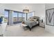 Bright main bedroom with light walls and carpet features large windows, light-blocking curtains, and modern decor at 408 Gaston Park Ln # 100, Wake Forest, NC 27587