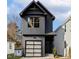 Modern two-story home with a single-car garage, gray siding, and black trim at 425 Longfellow St, Fuquay Varina, NC 27526