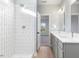 Modern bathroom with a tiled shower, double vanity, and stylish fixtures at 431 Longfellow St, Fuquay Varina, NC 27526