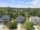Overhead view of a beautiful house with an attached garage and lush green surroundings at 449 Sandy Whispers Pl, Cary, NC 27519
