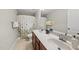 Bathroom featuring a dual sink vanity with modern faucets and a shower-tub combo with a floral curtain at 449 Sandy Whispers Pl, Cary, NC 27519