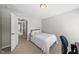 Bedroom features plush carpeting, a desk, and a neutral color scheme at 449 Sandy Whispers Pl, Cary, NC 27519