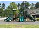 Community playground with slides, climbing structures, and interactive panels, perfect for Gathering fun at 449 Sandy Whispers Pl, Cary, NC 27519