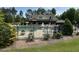 Community pool area with comfortable lounge chairs, a lifeguard station, and an attractive covered veranda at 449 Sandy Whispers Pl, Cary, NC 27519