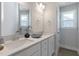 Stylish bathroom with double vanity, modern fixtures, and a window bringing in natural light at 45 Addison Pond Ct # 11, Zebulon, NC 27597