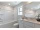 All white bathroom showcasing a bathtub, shower, and single vanity with ample lighting at 45 Addison Pond Ct # 11, Zebulon, NC 27597