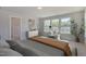 Spacious bedroom featuring large windows, stylish furnishings, and serene ambiance at 45 Addison Pond Ct # 11, Zebulon, NC 27597