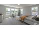 Sun-filled bedroom with large windows, neutral colors, and a cozy seating area at 45 Addison Pond Ct # 11, Zebulon, NC 27597