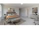 Bright bedroom with a comfortable bed, modern decor, and soft carpet at 45 Addison Pond Ct # 11, Zebulon, NC 27597