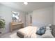 Well-lit bedroom with a vanity, calming decor, and neutral tones at 45 Addison Pond Ct # 11, Zebulon, NC 27597