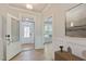 Welcoming foyer with wood floors and white trim, offering a view into the living areas at 45 Addison Pond Ct # 11, Zebulon, NC 27597