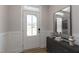 Bright foyer featuring wainscoting and a stylish gray console table with modern decor at 45 Addison Pond Ct # 11, Zebulon, NC 27597