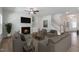 Cozy living room features a fireplace, neutral furniture, and a view of the staircase at 45 Addison Pond Ct # 11, Zebulon, NC 27597