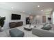 Spacious living room with plush seating, large TV, and neutral decor creating a comfortable space at 45 Addison Pond Ct # 11, Zebulon, NC 27597