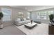 Bright living room with neutral tones, plush seating, and ample natural light at 45 Addison Pond Ct # 11, Zebulon, NC 27597