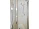 Modern shower with glass doors and a rainfall shower head fixture at 4500 Hollirose Pl, Raleigh, NC 27616