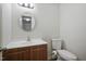 Bathroom featuring modern vanity and toilet at 4500 Hollirose Pl, Raleigh, NC 27616
