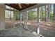 Relaxing screened-in porch with serene views of the wooded backyard at 4500 Hollirose Pl, Raleigh, NC 27616