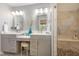Bright bathroom with double vanity, granite countertop and walk-in shower with stone floor and tiled walls at 53 Westridge Dr, Durham, NC 27713
