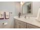 Bathroom vanity with marble countertop, decorative towels, and a shower with glass doors at 53 Westridge Dr, Durham, NC 27713