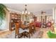 Cozy dining area with a chandelier and view into the living room at 53 Westridge Dr, Durham, NC 27713