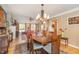 Open dining area with hardwood floors, seamlessly flowing to the living room at 53 Westridge Dr, Durham, NC 27713