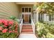 Inviting front entrance with brick steps and colorful landscaping at 53 Westridge Dr, Durham, NC 27713