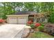 Charming home with two-car garage, beautifully landscaped yard, and mature trees at 53 Westridge Dr, Durham, NC 27713