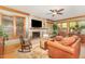 Inviting living room featuring a stone fireplace and large windows at 53 Westridge Dr, Durham, NC 27713