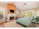 Bright main bedroom featuring a fireplace, vaulted ceilings, and multiple windows at 53 Westridge Dr, Durham, NC 27713