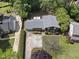 Aerial view showcasing the home's layout, driveway, and surrounding greenery at 5713 Timber Ridge Dr, Raleigh, NC 27609