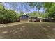 Large backyard with a deck provides ample space for outdoor activities at 5713 Timber Ridge Dr, Raleigh, NC 27609