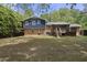 Expansive backyard with a deck offers outdoor living and entertaining at 5713 Timber Ridge Dr, Raleigh, NC 27609