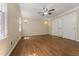 This bedroom features hardwood floors, a ceiling fan, and two closets at 5713 Timber Ridge Dr, Raleigh, NC 27609