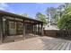 Wooden deck offers an outdoor seating area and screened in porch at 5713 Timber Ridge Dr, Raleigh, NC 27609