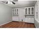 Dining room with hardwood floors, built-in cabinets, and ample natural light at 5713 Timber Ridge Dr, Raleigh, NC 27609