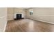 Cozy living room featuring a fireplace, wainscoting and a bright window at 5713 Timber Ridge Dr, Raleigh, NC 27609