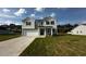Charming two-story home with a two-car garage and a well-manicured lawn in a quiet neighborhood at 580 Thomas Gage Dr, Fuquay Varina, NC 27526