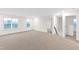 Spacious bonus room with neutral carpet, large windows, and a view into the hallway at 60 Rosewood Ln, Youngsville, NC 27596