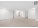 Expansive bonus room with neutral carpet and multiple doorways, creating an open feel at 60 Rosewood Ln, Youngsville, NC 27596