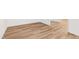 Close-up of light hardwood flooring, showcasing the natural grain and color variation throughout the home at 60 Rosewood Ln, Youngsville, NC 27596