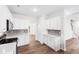 Kitchen boasts a gray backsplash, stainless steel appliances, and white countertops at 60 Rosewood Ln, Youngsville, NC 27596