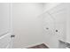 This laundry room boasts vinyl floors and convenient washer and dryer hookups at 60 Rosewood Ln, Youngsville, NC 27596