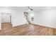Inviting living room featuring wood-look floors and a staircase leading to the upper level at 60 Rosewood Ln, Youngsville, NC 27596