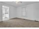 Cozy bedroom with carpeted floors, ceiling fan, and natural light from a window at 605 Dunbar St, Durham, NC 27701